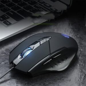 Ergonomic wired gaming mouse with blue LED lighting beside a laptop