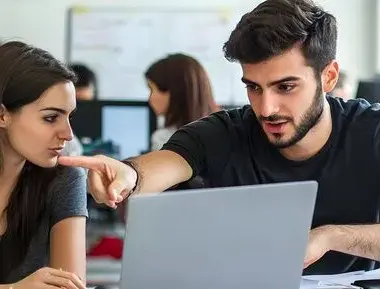 Two colleagues working together laptop office 605022 220657